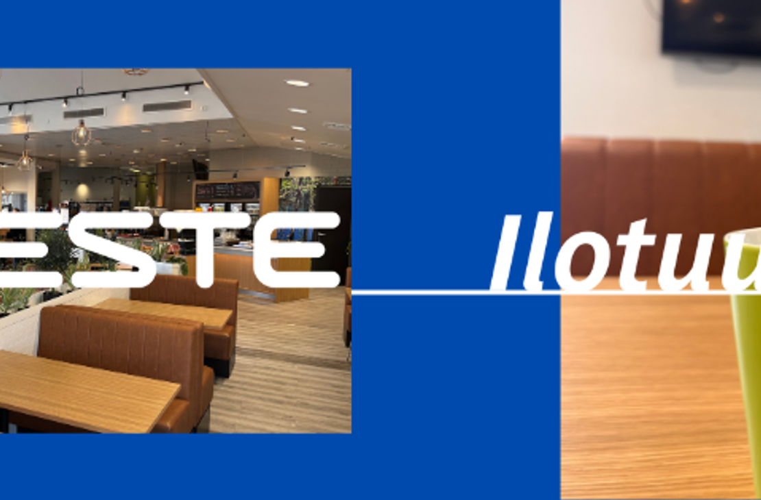 Ulkokuva lumisesta Neste Iilotuuli -huoltoasemasta, jonka edess&auml; on opastetaulu palveluista kuten huolto, lounas ja kahvila. Kuvan yl&auml;reunassa on Neste Iilotuuli -logo sinisell&auml; pohjalla.